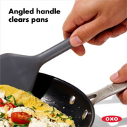 OXO Good Grips Silicone Turner with black silicone head and soft non-slip handle.