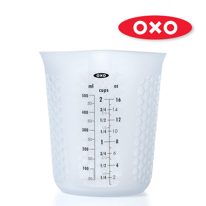 OXO Good Grips 2-Cup / 500ml Squeeze & Pour Measuring Cup with flexible silicone body and clear measurement markings.