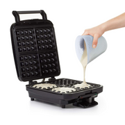 OXO Good Grips 2-Cup / 500ml Squeeze & Pour Measuring Cup with flexible silicone body and clear measurement markings.