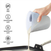 OXO Good Grips 2-Cup / 500ml Squeeze & Pour Measuring Cup with flexible silicone body and clear measurement markings.