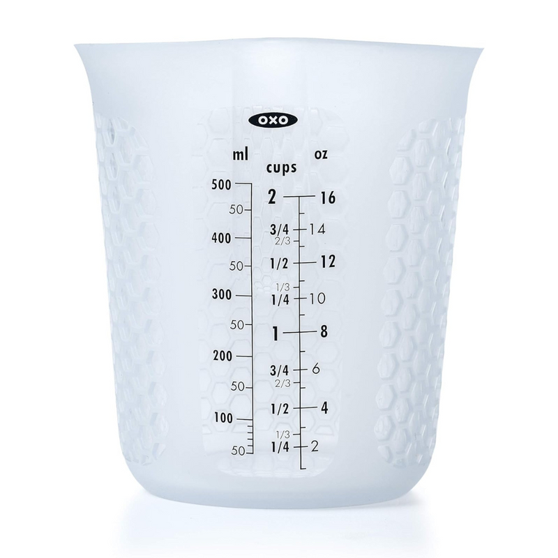 OXO Good Grips 2-Cup / 500ml Squeeze & Pour Measuring Cup with flexible silicone body and clear measurement markings.