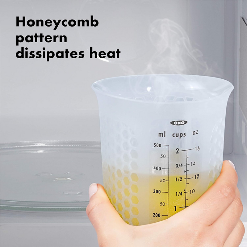 OXO Good Grips 2-Cup / 500ml Squeeze & Pour Measuring Cup with flexible silicone body and clear measurement markings.