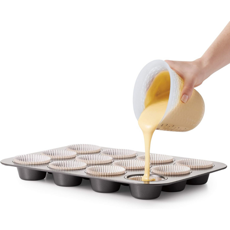 OXO Good Grips 2-Cup / 500ml Squeeze & Pour Measuring Cup with flexible silicone body and clear measurement markings.