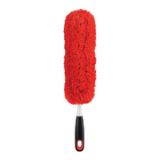 OXO Good Grips Microfiber Hand Duster cleaning a shelf