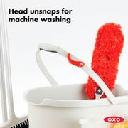 OXO Good Grips Microfiber Hand Duster cleaning a shelf