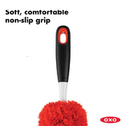 OXO Good Grips Microfiber Hand Duster cleaning a shelf