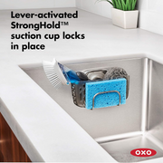 OXO Good Grips Stronghold Suction Sink Caddy attached to sink wall
