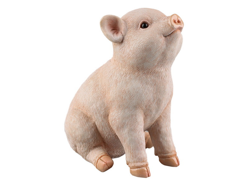 Small sitting pig figurine