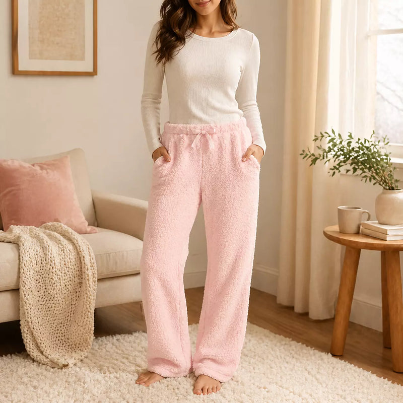 Ladies long plush PJ pants with pockets in assorted designs, offering soft, cosy comfort for sleep and relaxing at home.