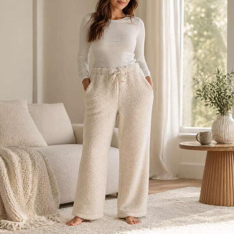 Ladies long plush PJ pants with pockets in assorted designs, offering soft, cosy comfort for sleep and relaxing at home.