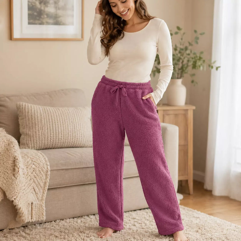 Ladies long plush PJ pants with pockets in assorted designs, offering soft, cosy comfort for sleep and relaxing at home.