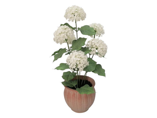 Artificial white flower in clay pot