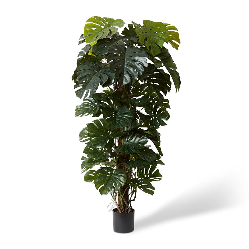 Tall artificial green monstera totem plant in pot