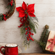 Poinsettia Pine Hanger with red flowers and pine greenery, festive hanging Christmas decoration.