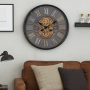 60cm black industrial round wall clock with exposed gold moving cogs and Roman numeral display