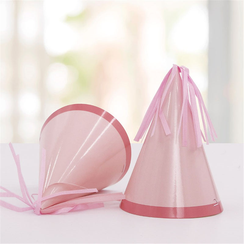 Pink paper party hats with tassel