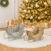 Small assorted Christmas sleigh decorations covered in festive sequins – perfect for holiday displays