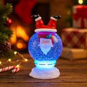21cm snow globe featuring Santa Claus inside with swirling snow and festive base