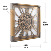 Square gold and silver wall clock with exposed gears and Roman numerals, 80x80cm