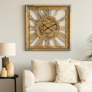 Square gold and silver wall clock with exposed gears and Roman numerals, 80x80cm