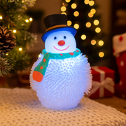 Squishy light-up snowman toy glowing with colourful lights for Christmas fun