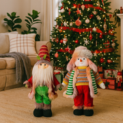 70cm assorted standing Santa and Mrs Claus Christmas figurines in festive outfits for floor or entryway decor