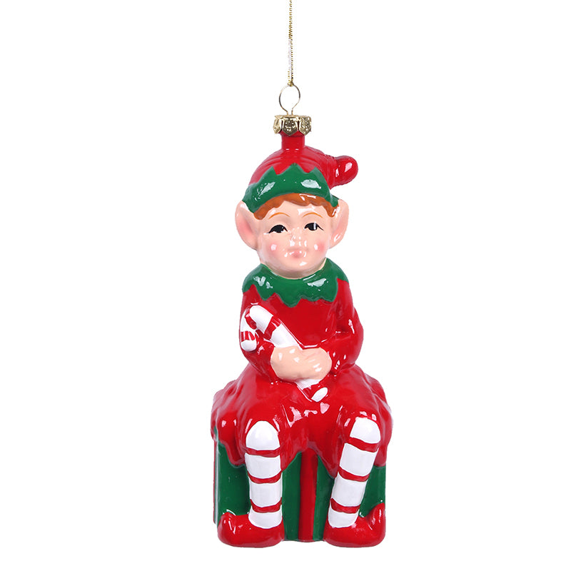 13.3cm Christmas tree ornament featuring a cheerful elf sitting on a festive gift box