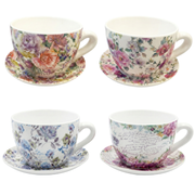 Set of four floral teacups and saucers on a white background – thumbnail