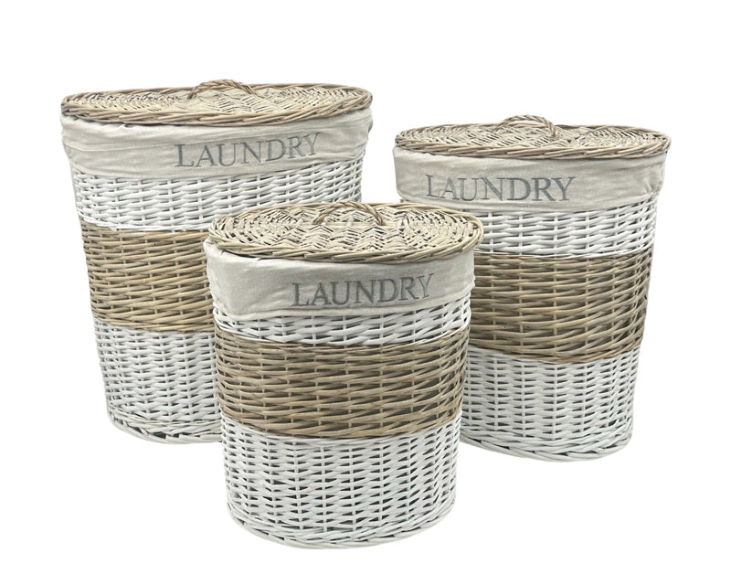 Set of three oval willow laundry baskets with natural woven finish