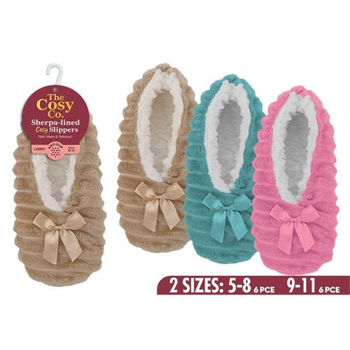 Plush indoor footwear with a decorative ribbon accent