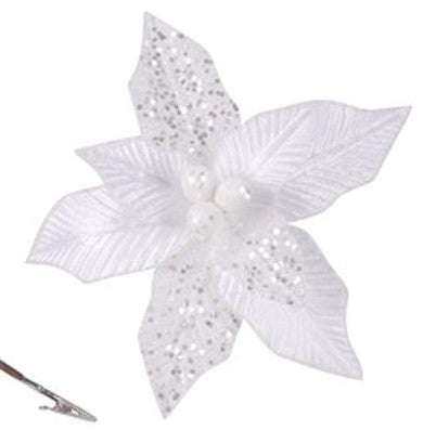 White decorative flower with rhinestones and a hair clip on a white background