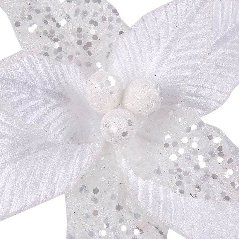 Close-up of a white flower with silver glitter on a white background