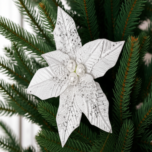 Decorative white poinsettia flower on green pine branches