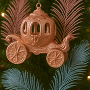 Copper-colored carriage ornament on a Christmas tree