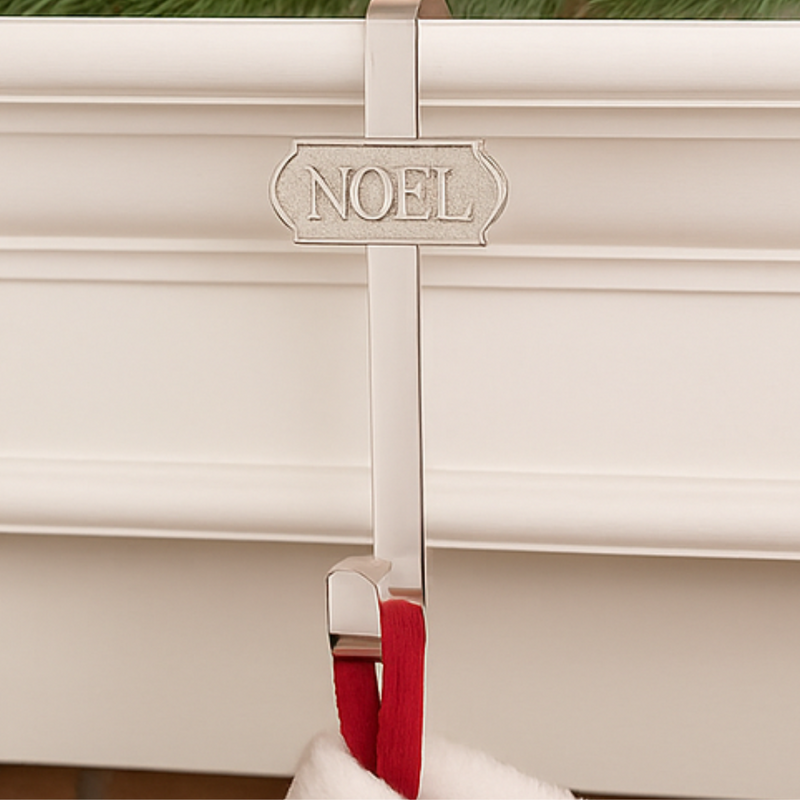 Decorative hook with 'NOEL' inscription on a white background