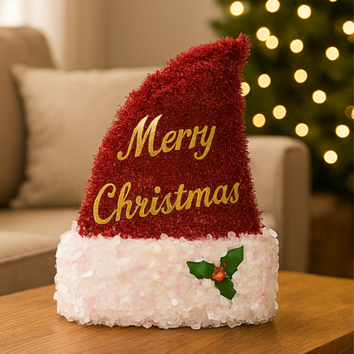 Decorative Christmas light with 'Merry Christmas' text on a table in a cozy living room.