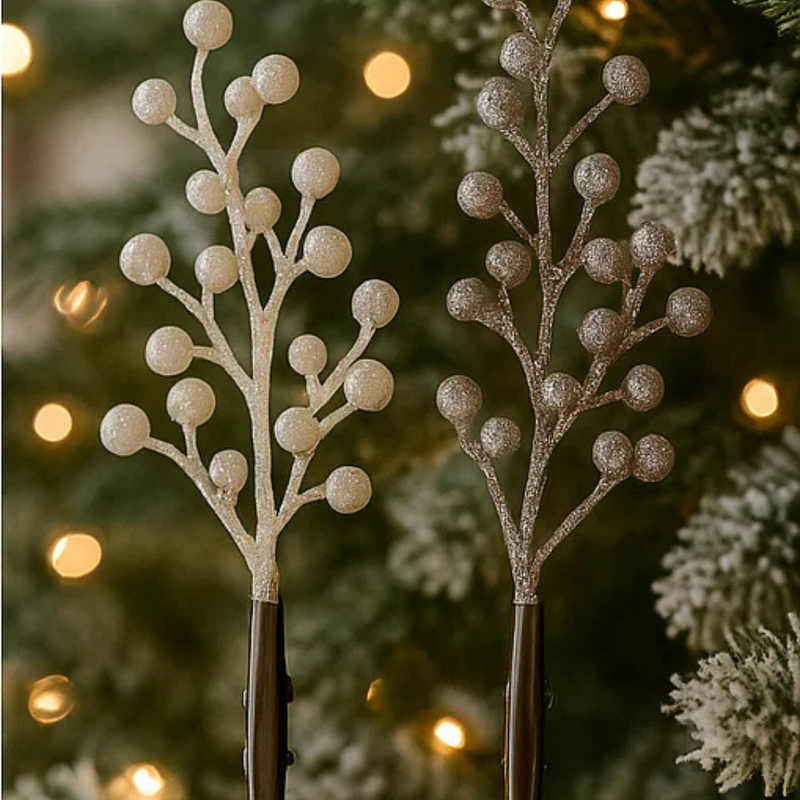 Decorative branches with glittery berries against a Christmas tree background