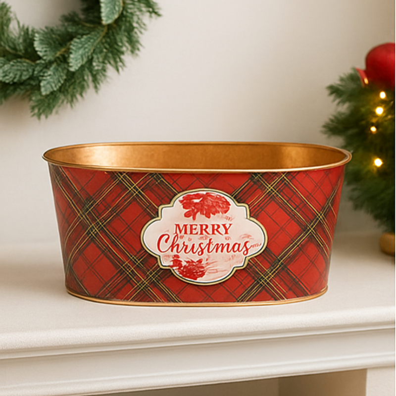 Decorative Christmas tin with plaid pattern and 'Merry Christmas' label on a white surface.