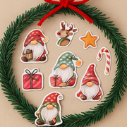 Set of Christmas-themed stickers including gnomes, a star, and candy canes, arranged on a wreath with greenery.