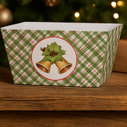 Decorative Christmas box with plaid pattern and bell design on a wooden surface.