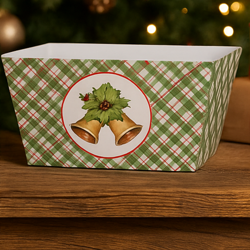 Decorative Christmas box with plaid pattern and bell design on a wooden surface.