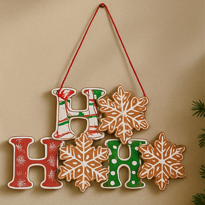Decorative wall hanging with 'H' letters and snowflake shapes on a beige background