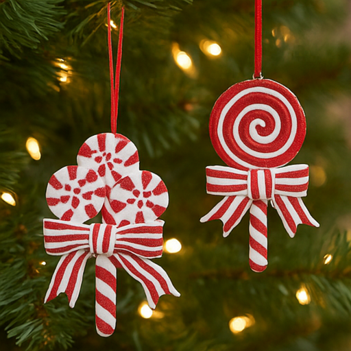 Two red and white candy-themed Christmas ornaments hanging on a tree.