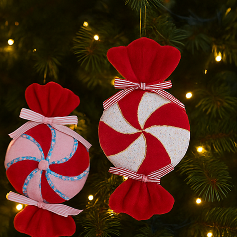 Red and white candy bag ornaments with bows on a Christmas tree.
