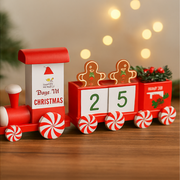 Decorative Christmas train with gingerbread men and candy cane details on a wooden surface.