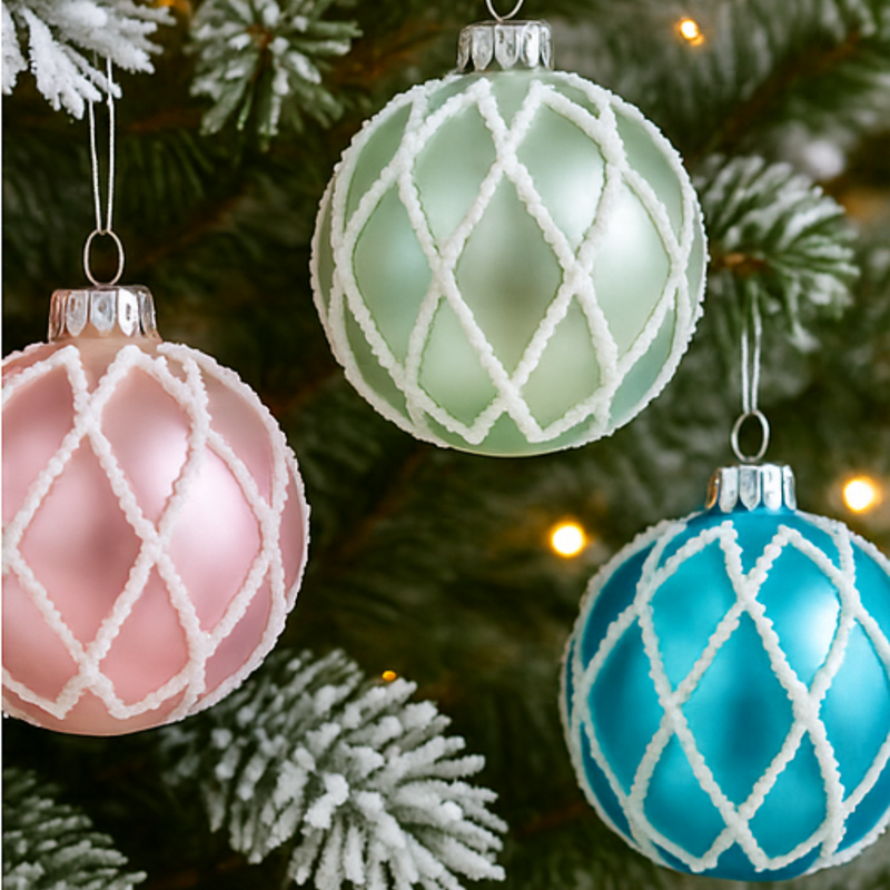 Decorative Christmas ornaments with lattice patterns on a tree.