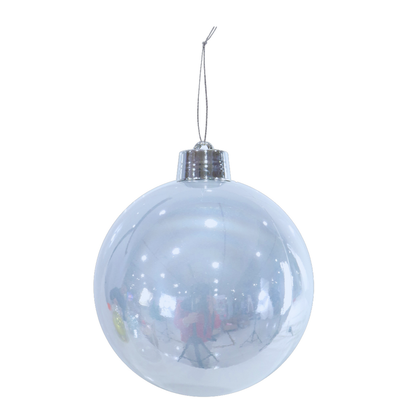 Clear Christmas ball ornament with silver cap on a white background