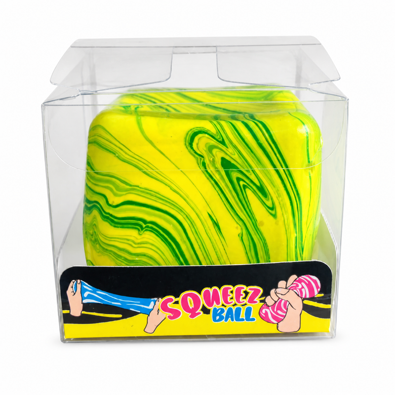 Yellow and green marbled squeezable ball in a clear packaging box with 'SQUEEZ BALL' branding.