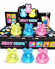 Jelly Hop sensory squeeze toys in various colors with packaging in the background. – thumbnail