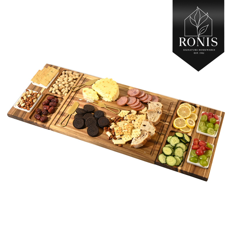 Wooden charcuterie board with assorted foods on a white background, featuring the Ronis Signature Homeware.